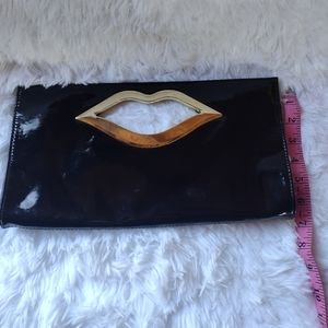 Black and gold lip clutch purse